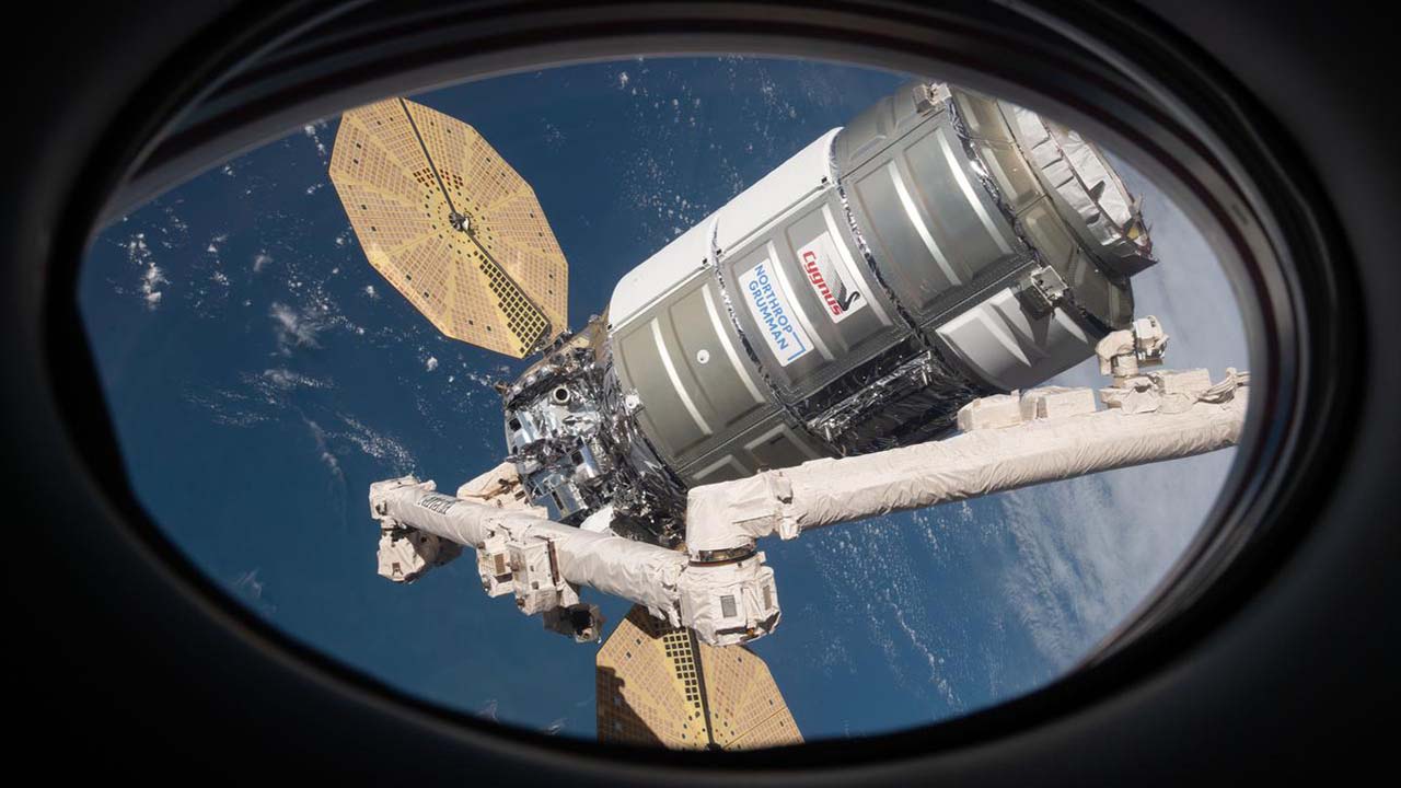 The Cygnus space freighter from is pictured with the Canadarm2 robotic arm in February 2022.