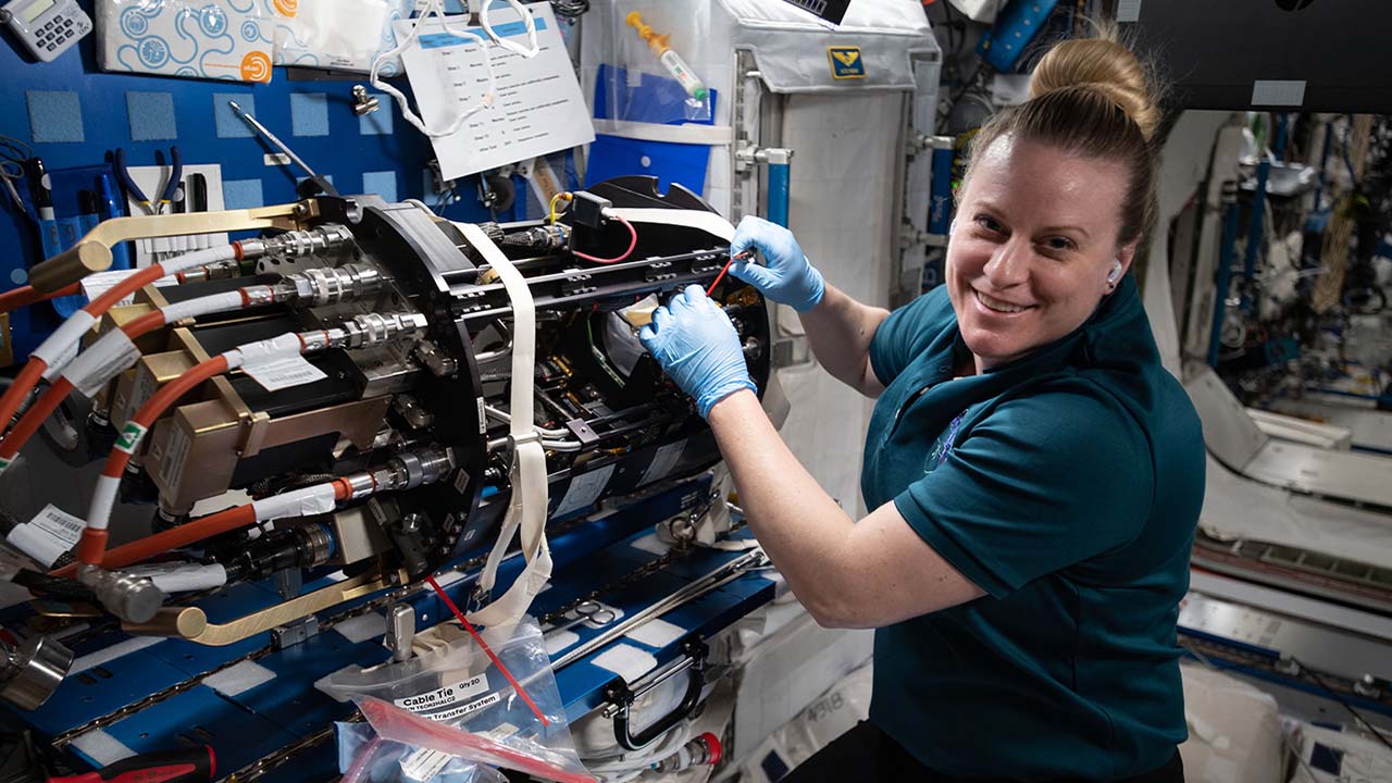 NASA astronaut Kate Rubins working on the cool flames investigation preparation.