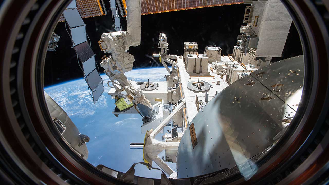 upward71-orbital-sidekick-nerp-exterior (1) View of the NREP through a window in the Japanese Experiment Module, nicknamed Kibō.